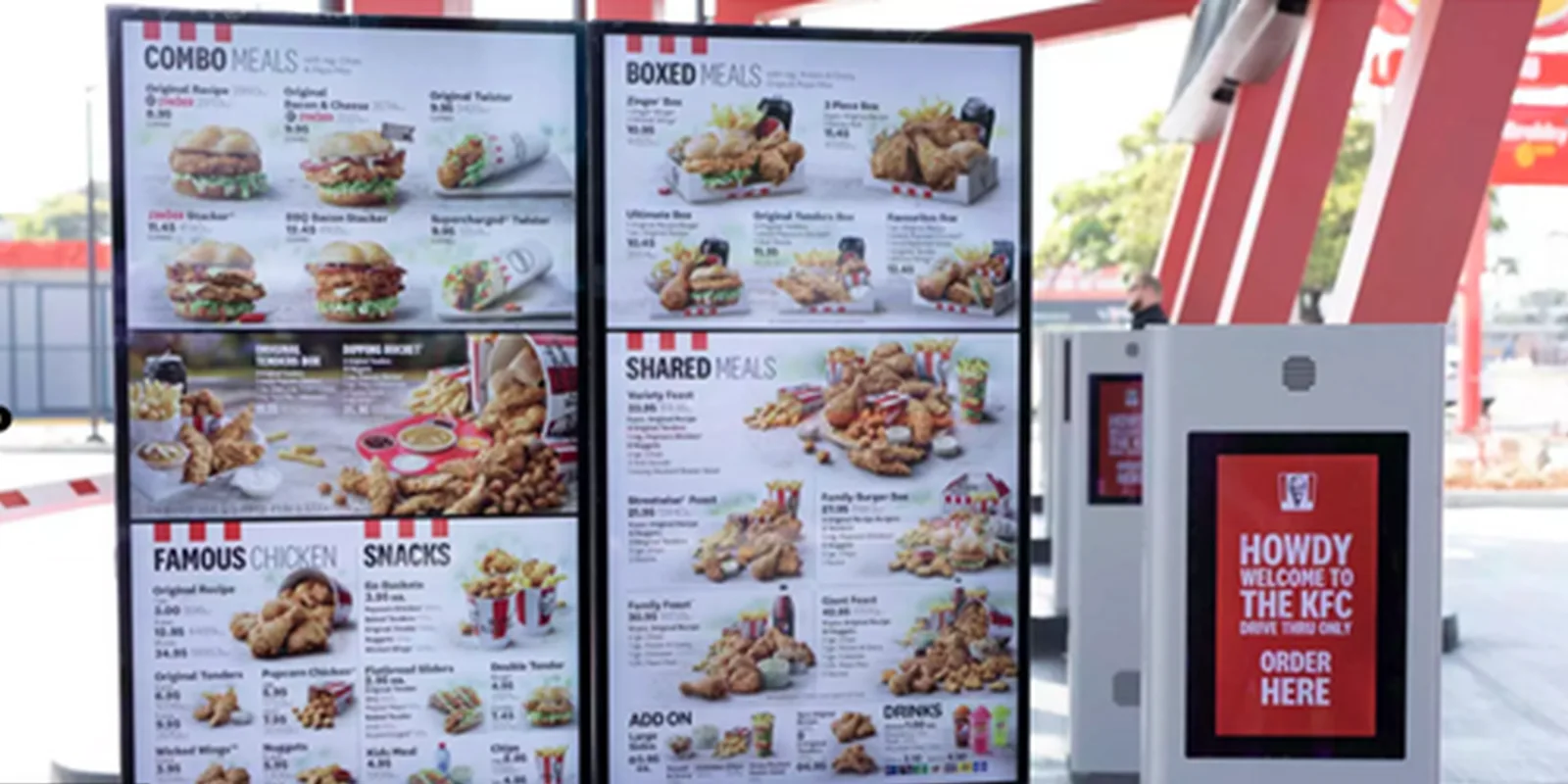 Outdoor digital menu board array with an adjacent order point at a quick service restaurant